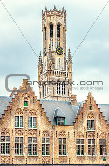 Tower Belfort in Bruges Belgium on background