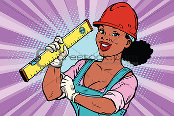 Construction worker with level. Woman professional