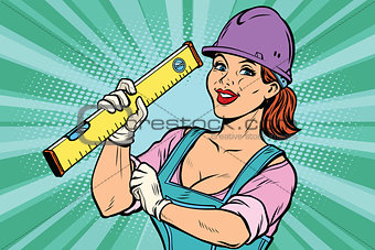 Construction worker with level. Woman professional