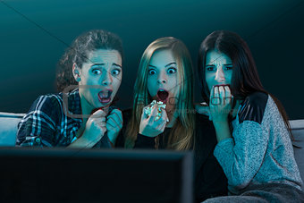 Scared teenage watching movies 