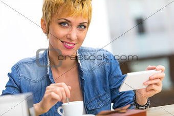 Young woman enjoying a cup of coffee