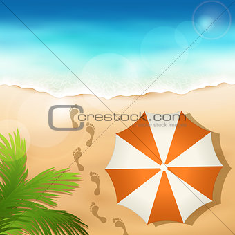 Sandy beach with a beach umbrella