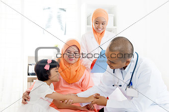 Asian medical doctor and patient. 