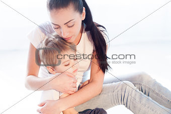 mom hugs her son sadness love