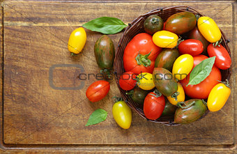 Ripe organic tomatoes in a wicker basket