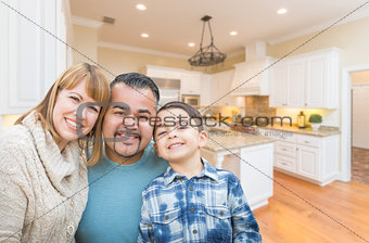 Happy Young Mixed Race Family Having Fun in Custom Kitchen.