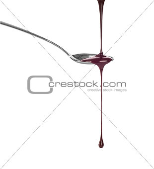 chocolate dripping from a spoon isolated on white background