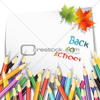 Paper sheet, colorful pencils and maple autumn leaves on white background.