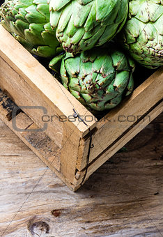 Artichoke. Box of fresh artichoke. Harvest concept. Copy space