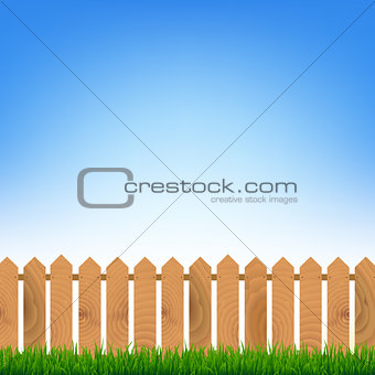 Fence With Green Grass And Blue Sky