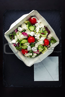 Greek salad with brynza top view.