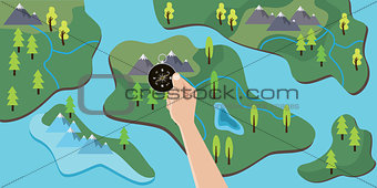 hand holding a compass on top of map to travel adventure