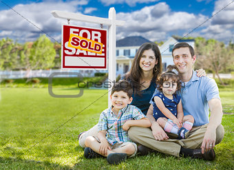 Young Family With Children In Front of Custom Home and Sold For 