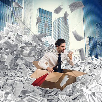 Businessman extricate himself from a sea of paper
