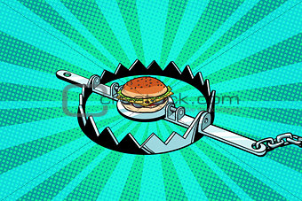 Iron trap with the Burger. concept of hunger and diet