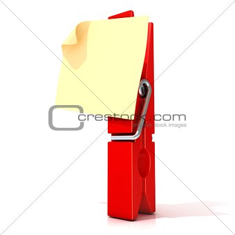 Red clothes pin with sticky note