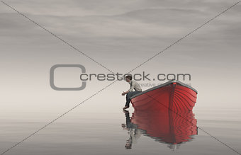 Man sits on the edge of a boats