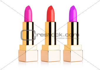 Golden containers of luxury cosmetic lipstick 