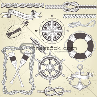 Vintage seafaring elements - steering wheel, oars, rope frame an