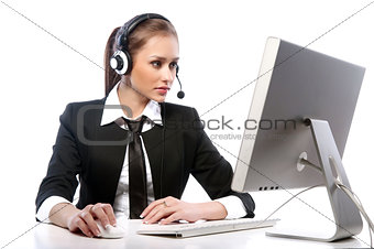 A young woman working at the computer on a white background