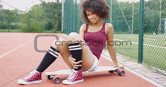 Flirty woman on skateboard