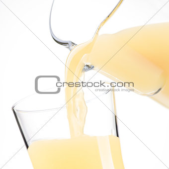 Pouring refreshing juice in a glass