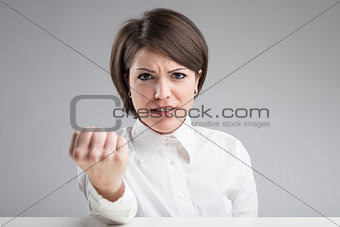 angry woman menacing to punch you