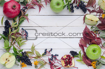 autumn background of leaves, fruits and berries