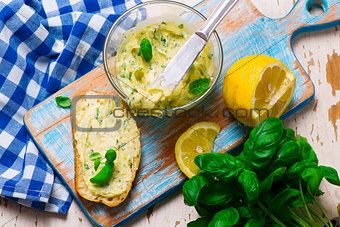 Butter with a basil and a lemon for sandwiches