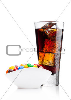 Round colorful coated sweet candies with cola
