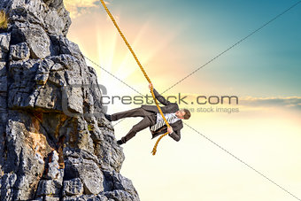 Businessman climb a mountain