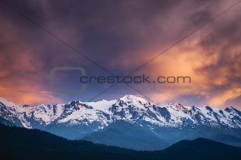 Sunset evening view over the snowy mountain range