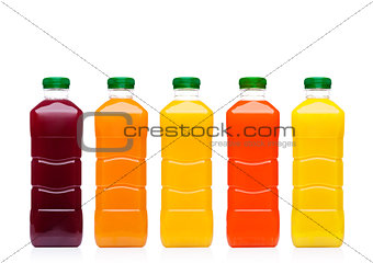 Glass bottles with fresh organic juice on white