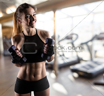 Determinated girl at the gym ready to start fitness lesson