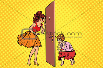 Two women spy on each other through the door