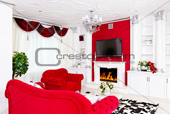 Classical red living room interior with fire place and red furni