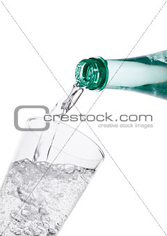 Pouring sparkling mineral water from bottle