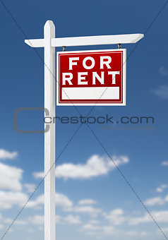 Right Facing For Rent Real Estate Sign on a Blue Sky with Clouds