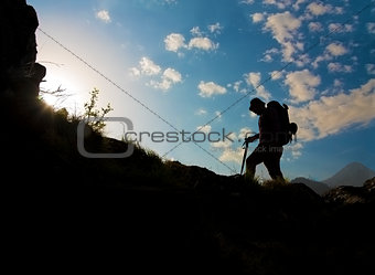 Silhouette of a man hiking