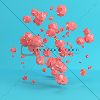 Red flying low poly spheres on bright blue background in pastel 