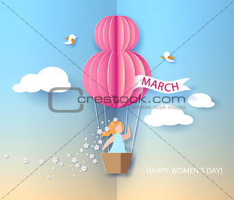Woman in basket of hot air balloon
