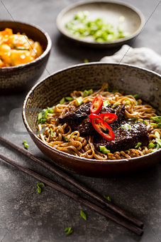 Soba noodles with beef and chopsticks