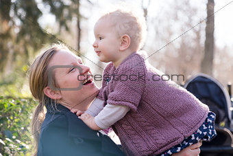 Father with cheerful child in the park.