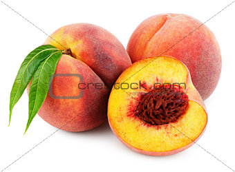 Peach with half and leaf isolated on white