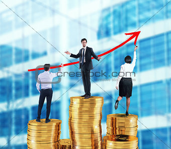 Business team draws growing arrow of company statistics over the piles of money