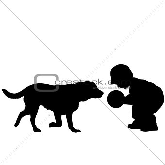 Toddler playing with a dog