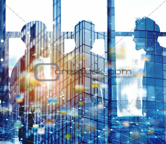 Businessmen that work together in office with network connection effect. Concept of teamwork and partnership. double exposure