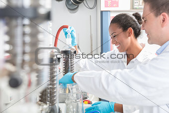 Researchers preparing test in scientific laboratory