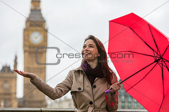 Woman With Umbrella by Big Ben, London, England
