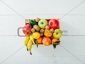 Fresh tasty fruit in a wooden crate